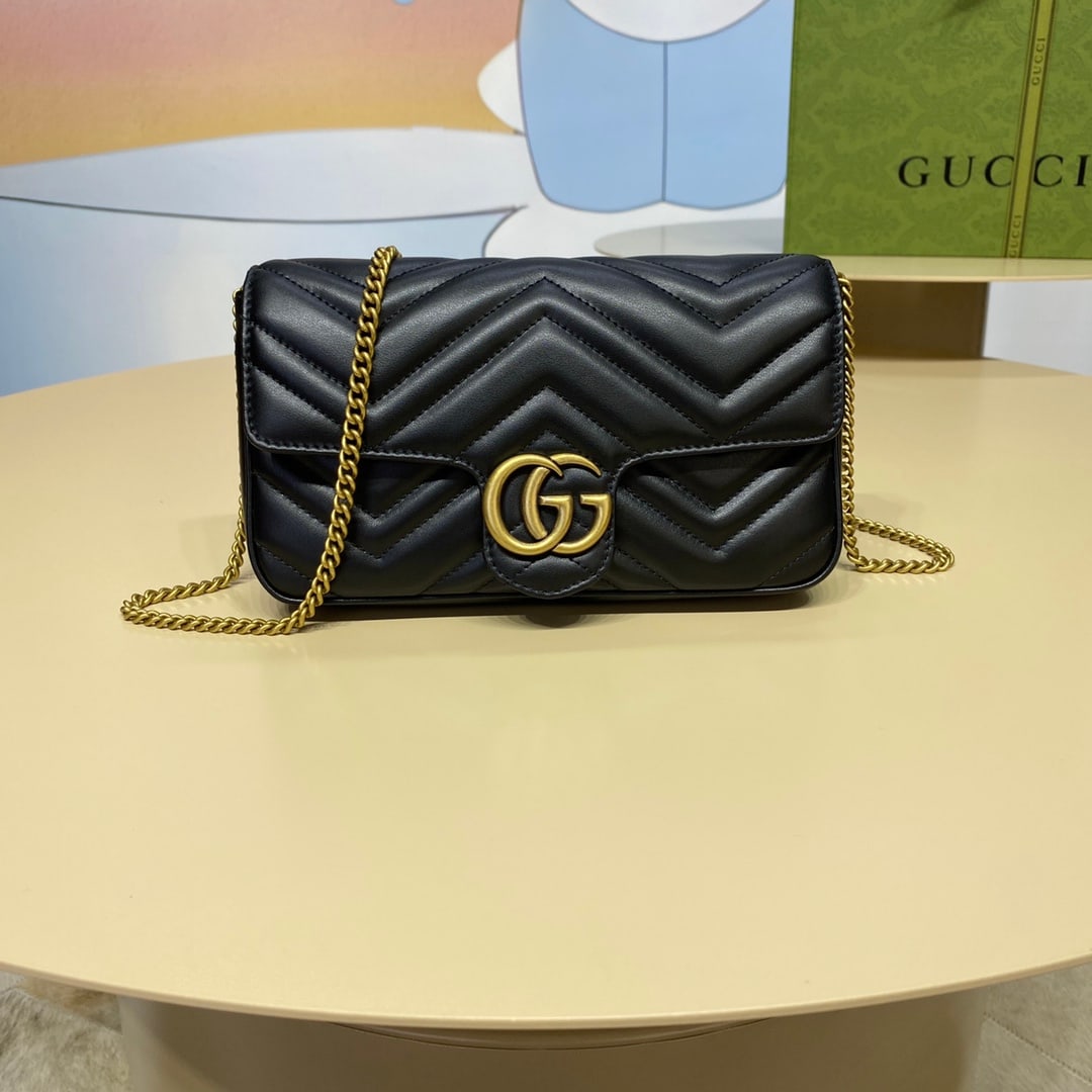 GUCCI MARMONT: The GUCCI MARMONT mini handbag (with card holder) features black double-G hardware that infuses classic essence into the brand's modern style, creating a timeless piece for any wardrobe. This mini han