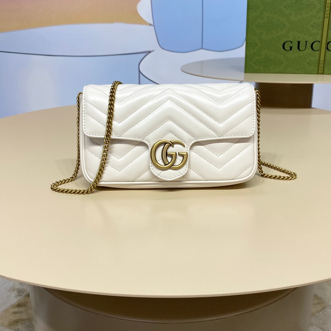 GUCCI MARMONT: The GUCCI MARMONT mini handbag (with card holder) features white double-G hardware that infuses classic essence into the brand's modern style, creating a timeless piece for any wardrobe. This mini