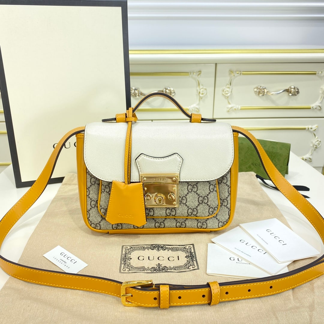 GUCCI Padlock: This beige mini Padlock shoulder bag from the GUCCI Padlock collection draws inspiration from archival designs, adding another stunning piece to the Infinite Prelude series. Crafted from white leather