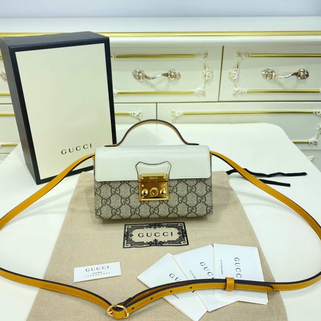 GUCCI Padlock: The GUCCI Padlock Mini White and Yellow Handbag: The Padlock series briefcase and chain box bag have finally shed the burden of the chain shoulder strap! They've been replaced with a leather shoulder 