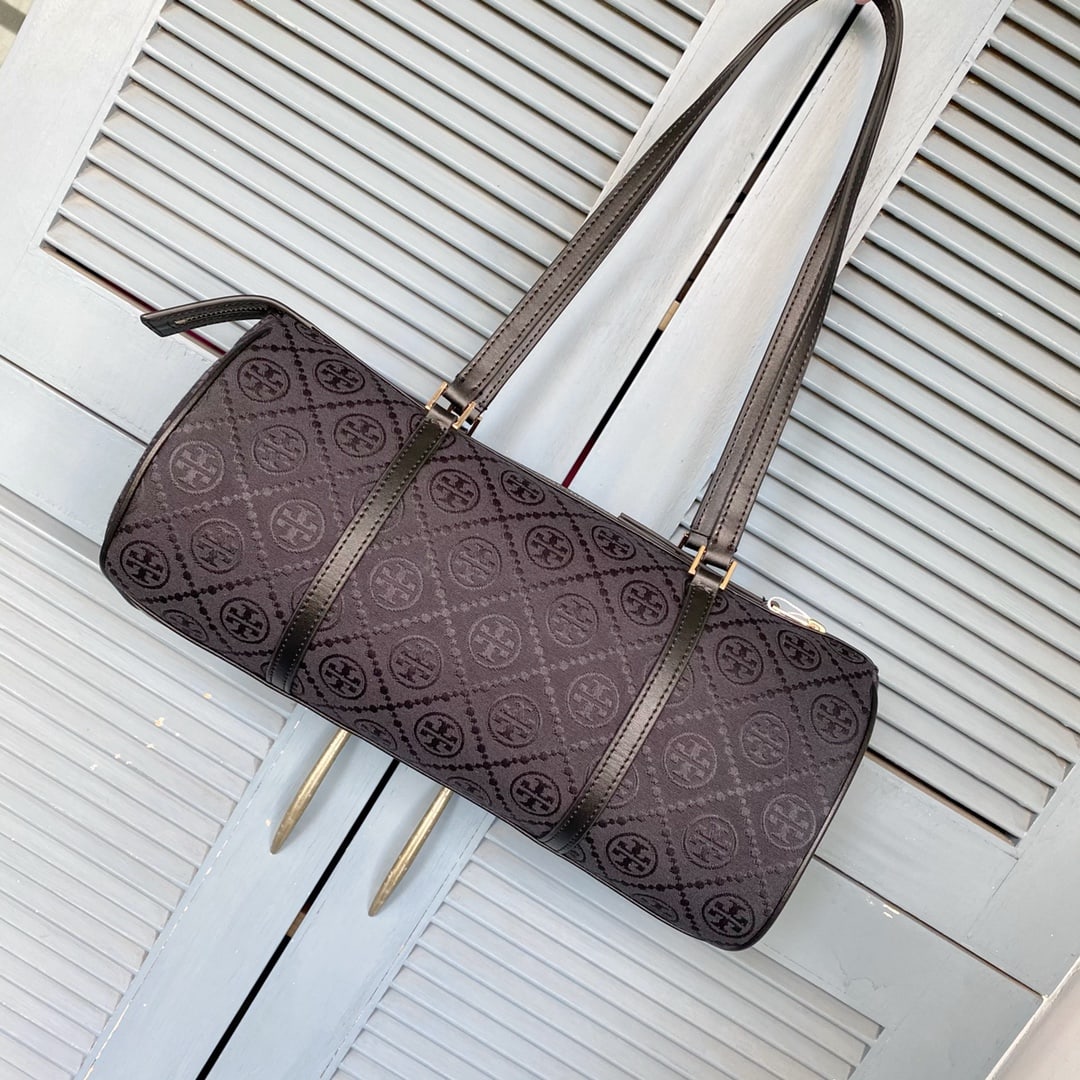Tory Burch Monogram: The T Monogram barrel bag blends classic silhouette with modern luxury, offering both sophistication and practicality. Inspired by 16th-century sailor style, it embodies perfect proportions and a
