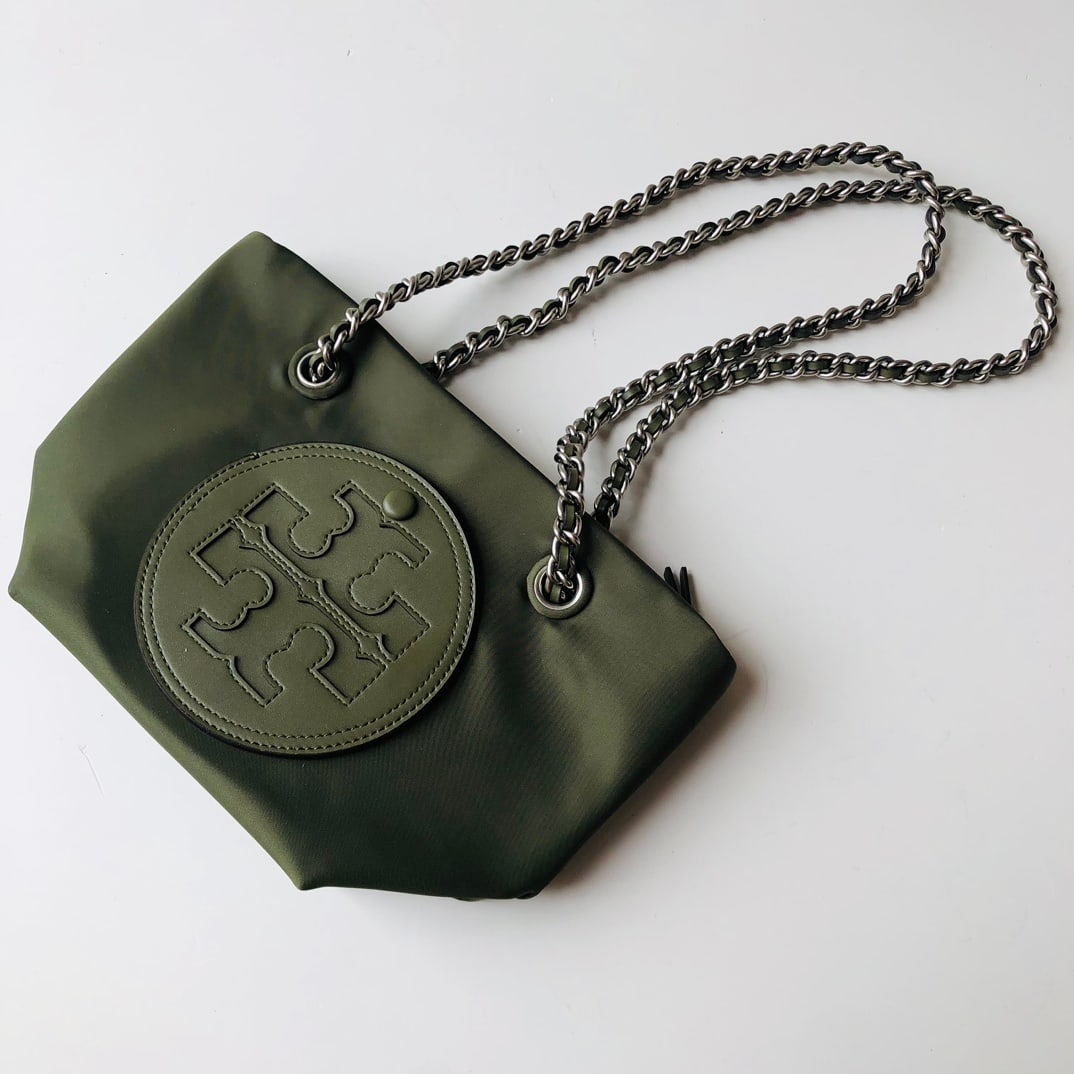 Tory Burch: The Ella Tote Chain Small Crossbody Bag is soft and lightweight, crafted from feather-light recycled nylon and featuring a woven chain strap for a soft, deconstructed style. Ideal for everyday wear
