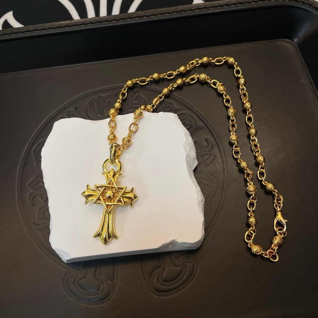 Chrome Hearts Classic Retro Necklace: Chrome Hearts classic gold multi-element necklace large cross pendant with embossed design and various patterns, presenting a unique style. The cross and scout flower are the hallmarks of Chrome Heart
