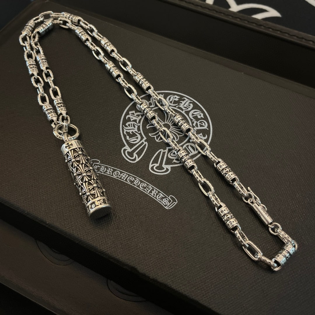 Chrome Hearts Classic Retro Necklace: Chrome Hearts classic retro cross-shaped necklace pendant. The embossed design and varied patterns create a unique look. The cross and scout flower are the hallmark of Chrome Hearts, making them timel