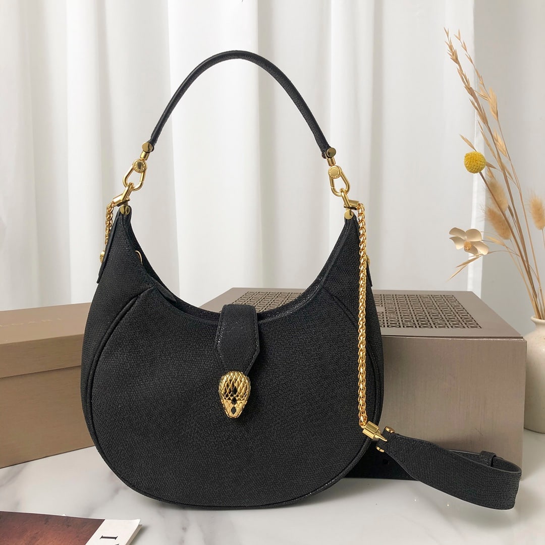 Bvlgari SERPENTI ELLIPSE: This medium-sized Bvlgari SERPENTI ELLIPSE crossbody/underarm bag is a uniquely styled, iconic, and versatile everyday bag crafted from moon silver-black metallic calfskin. It features a captivating c