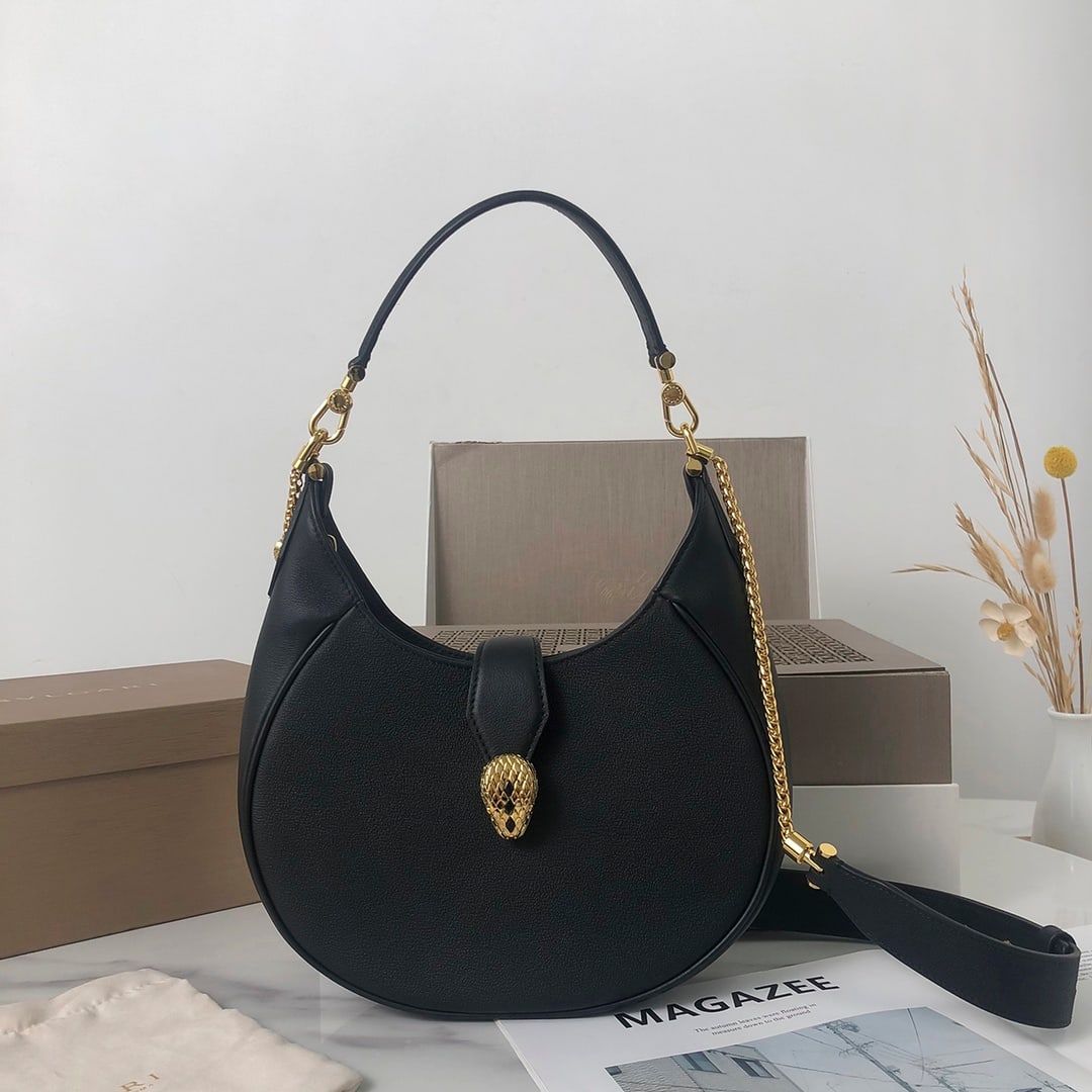 Bvlgari SERPENTI ELLIPSE: The Bvlgari SERPENTI ELLIPSE medium shoulder bag, with its unique shape, iconic details, and versatile charm, is an everyday bag crafted from black calfskin. The body is made of urban grain calfskin, 
