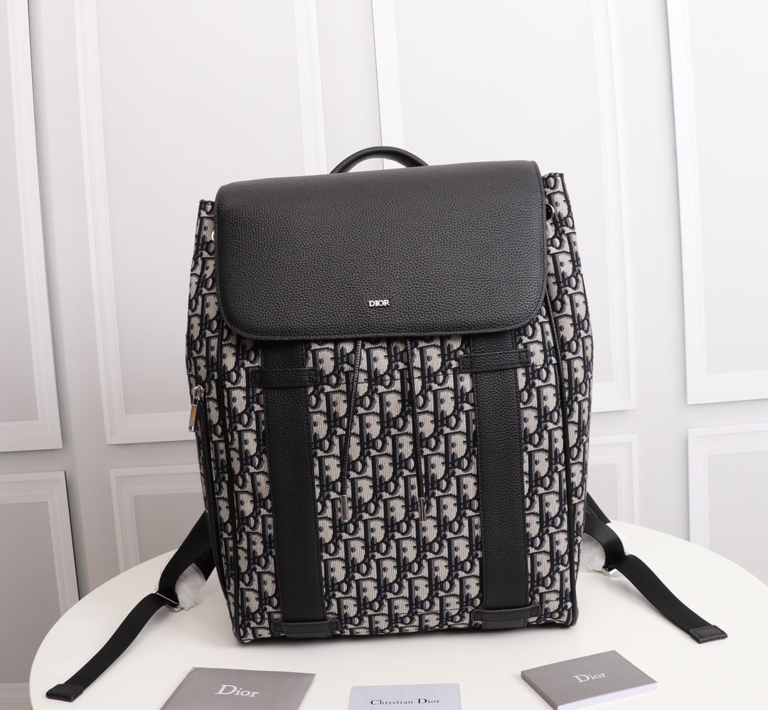 Christian Dior: Dior Oblique Men's Backpack (Apricot Jacquard) Motion Black Dior Oblique black jacquard and smooth black calfskin leather backpack, exterior Dior finish, interior Dior logo heat-stamped, one interior 