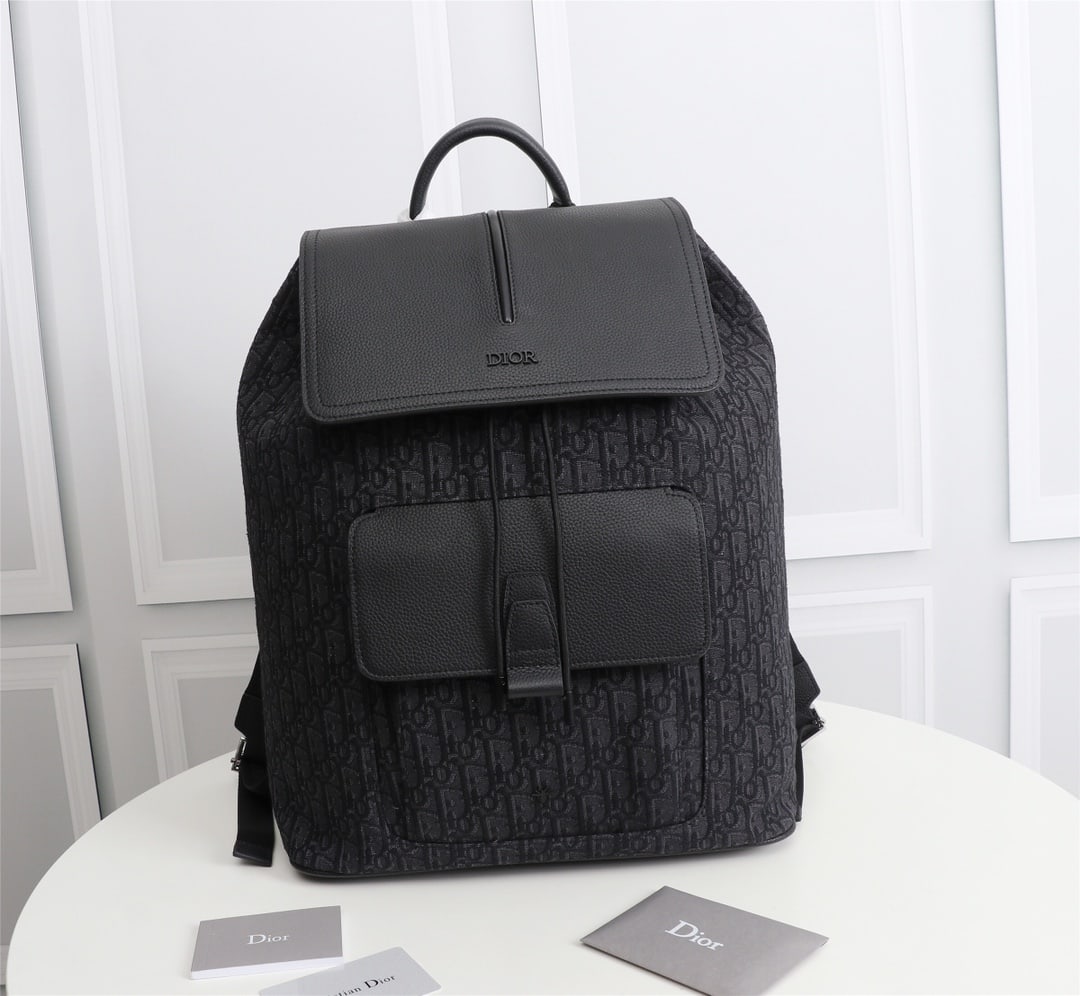 Christian Dior: Dior Men's OBLIQUE MOTION Backpack Model: 1MOBA062YPN (Black Jacquard) Beige and Black Oblique Print Front Brass Metal Coating DIOR Logo Interior with DIOR Embossed Logo Grained Cowhide Leather Flap a