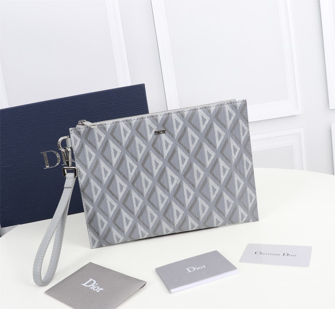 Christian Dior: The A5 clutch is an elegant and minimalist accessory. Crafted from Dior grey CD Diamond patterned canvas, it draws inspiration from the Dior archives and is adorned with tonal smooth calfskin details.