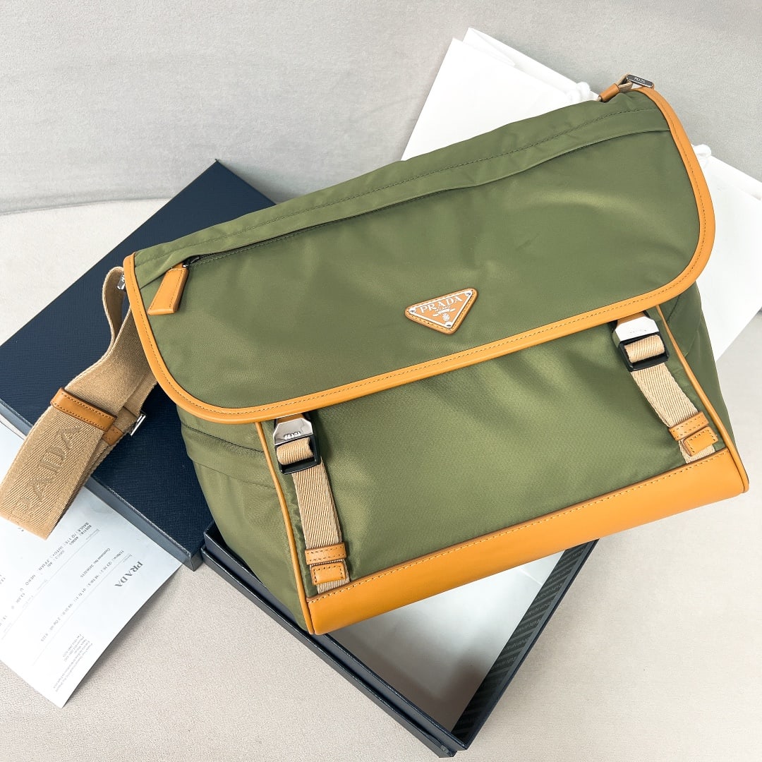 PRADA messenger bag: This messenger bag is designed from Re-Nylon recycled nylon fabric and features contrasting calfskin leather. It has a flap and push-lock closure, three exterior zip pockets, an interior zip pocket, a