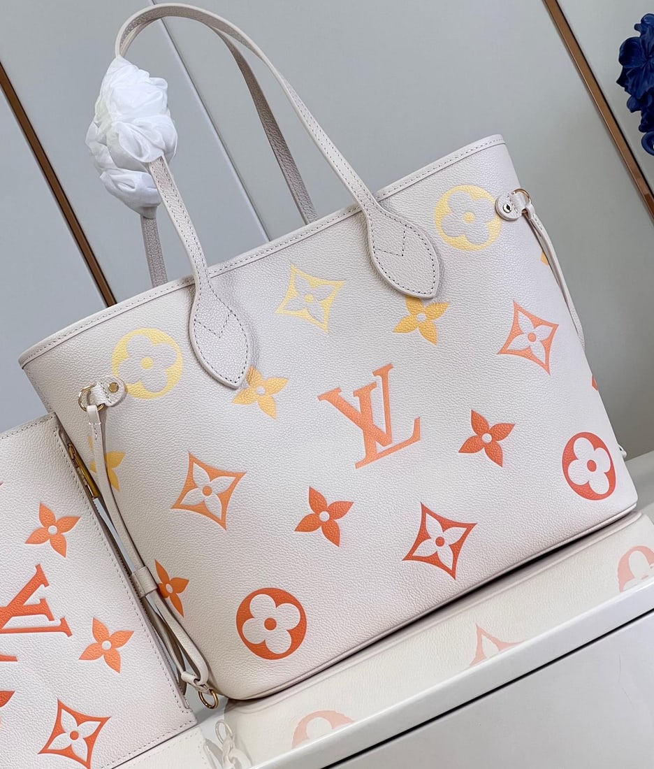 LV Neverfull: The Neverfull medium handbag exudes a soft and elegant charm in Monogram Empreinte leather, adorned with large, gradient-colored LV lettering and Monogram flowers. Unfastening the side drawstring tran