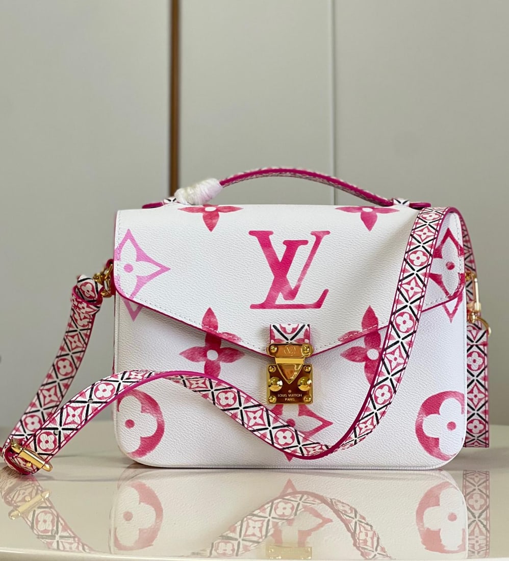 LV POCHETTE METIS: The Pochette Metis handbag features a watercolor effect of LV monogram and Monogram flowers on canvas, with intricate Monogram flowers adorning the top handle and detachable shoulder strap, drawing