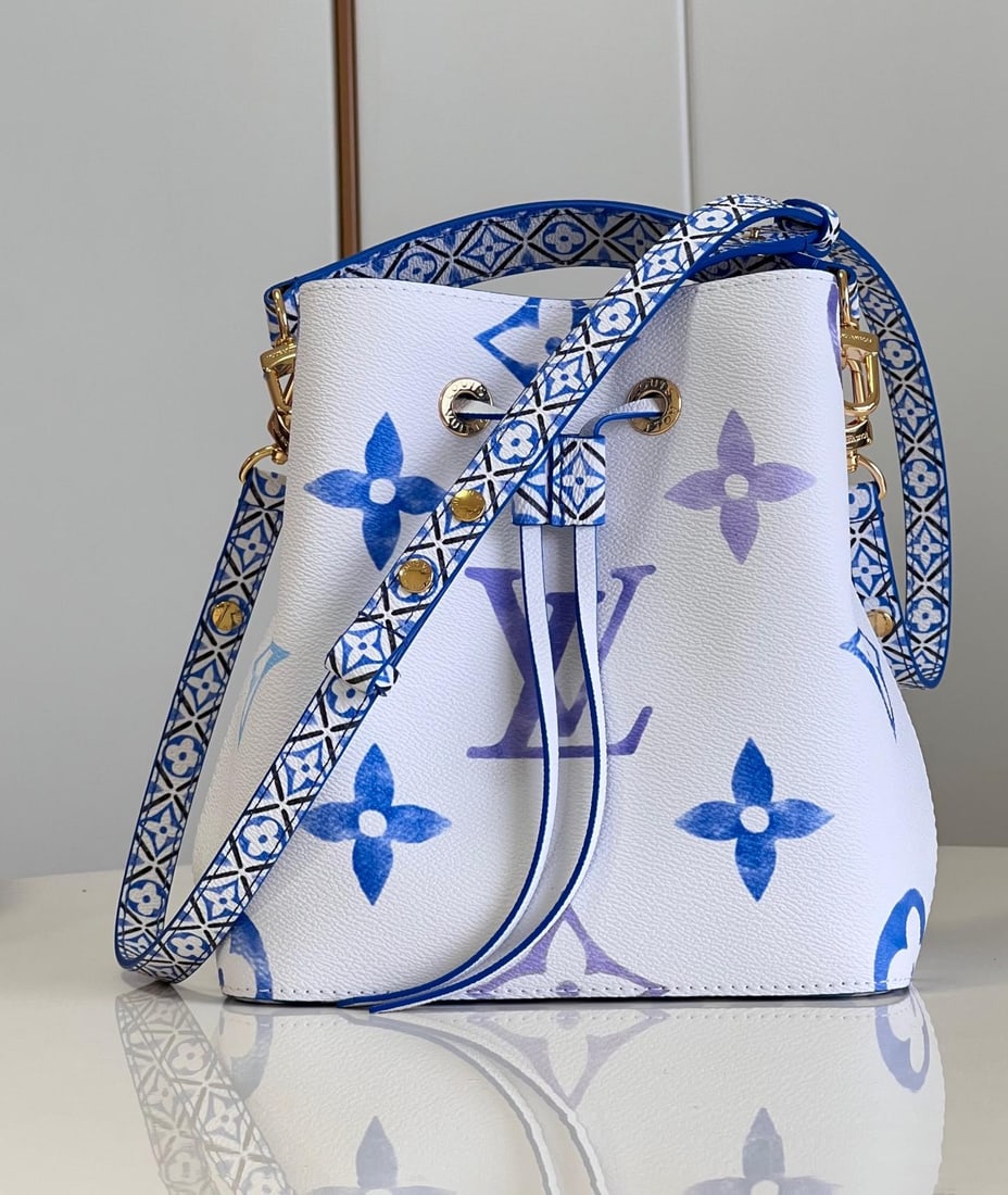 LV NeoNoE: The NeoNoE bucket bag features a Giant Monogram print on delicate canvas, giving the LV and Monogram flowers a watercolor effect in varying shades. It comes with a drawstring closure and a central sna