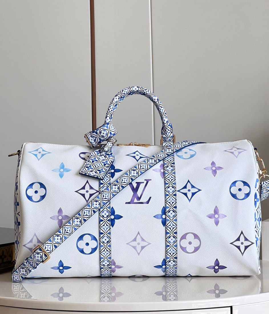 LV Keepall BandouliEre: The Keepall BandouliEre 45 travel bag is crafted from Giant Monogram canvas, featuring subtle variations in the same shade of color for the LV monogram and Monogram flowers. The side straps, top handl