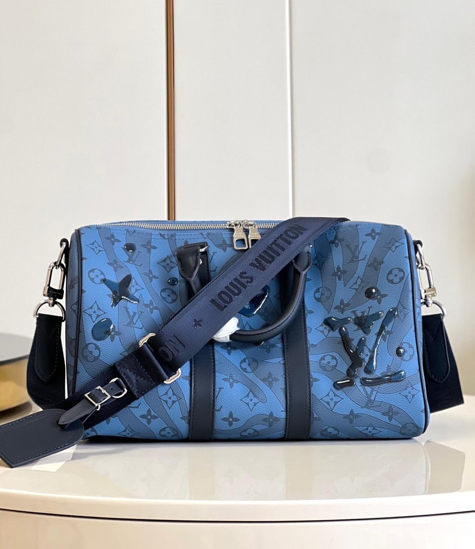 LV Keepall BandouliEre: The Keepall BandouliEre 35 handbag is crafted from Monogram Aquagarden canvas, making the Monogram flowers and LV logo appear as gently flowing water droplets. The side straps and rolled leather top h