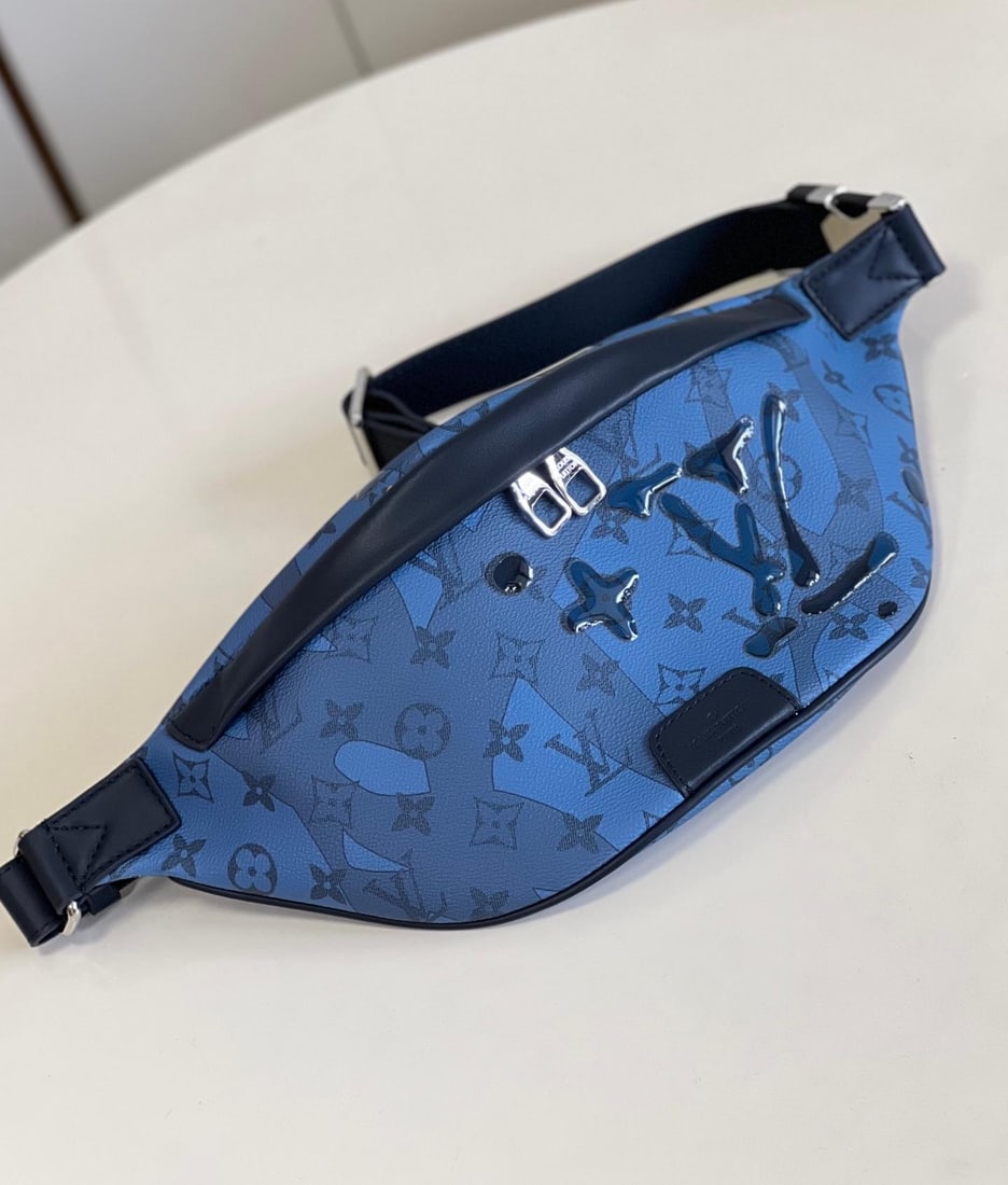 LV Discovery: The Discovery belt bag is crafted from Monogram Aquagarden canvas, seemingly emerging from the icy depths of the ocean. An innovative inkjet printing process creates a three-dimensional water droplet 