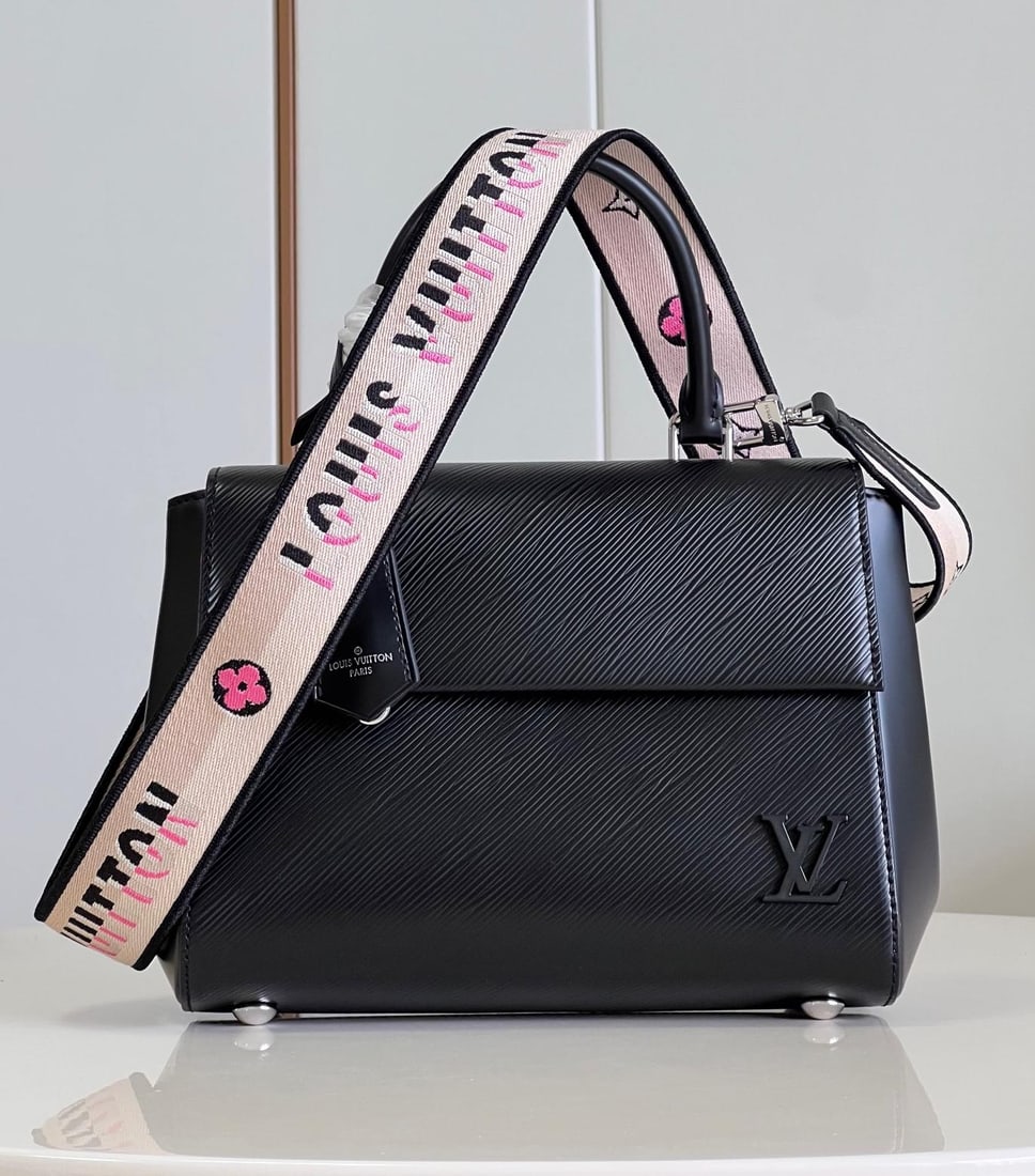 LV Cluny: The black Cluny BB handbag features a novel twill pattern on Epi leather, paired with a smooth resin LV logo and a bright lining. The detachable reversible shoulder strap, with its vibrant jacquard de