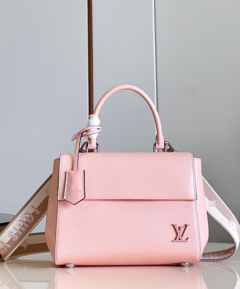 LV Cluny: The Cluny BB handbag features a novel twill pattern on Epi leather, paired with a smooth resin LV logo and a bright lining. The detachable reversible shoulder strap, with its vibrant jacquard, exudes