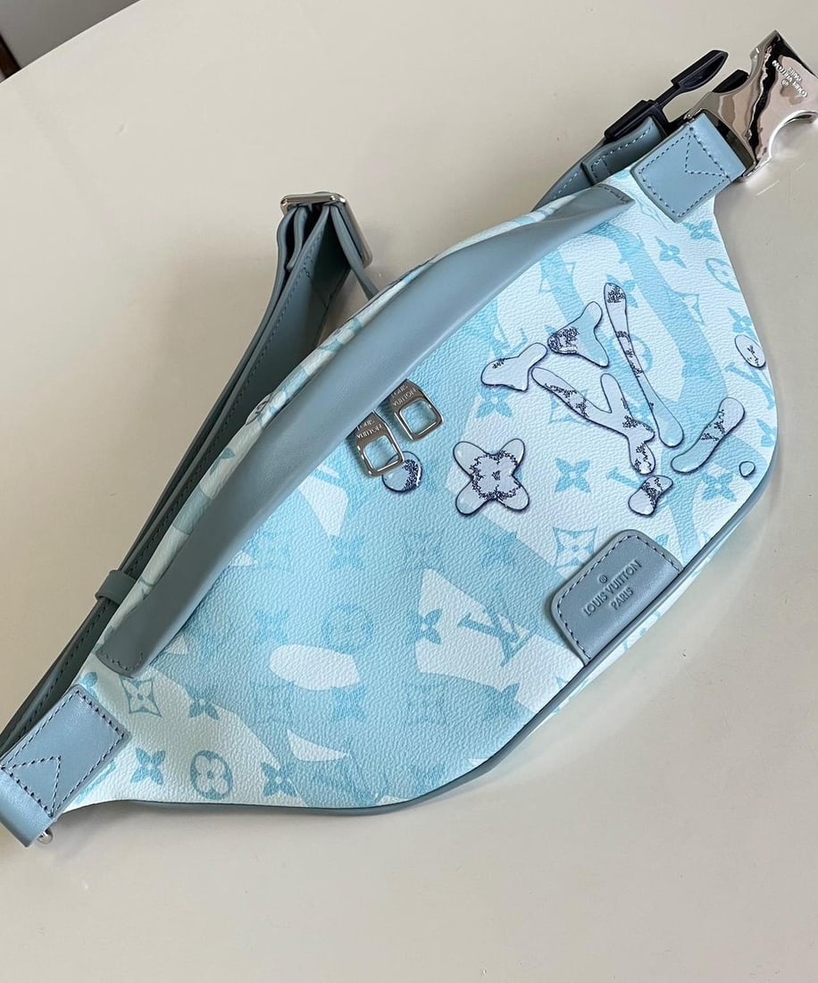 LV Discovery: The Discovery belt bag is crafted from Monogram Aquagarden canvas, seemingly emerging from the icy depths of the ocean. An innovative inkjet printing process creates a three-dimensional water droplet
