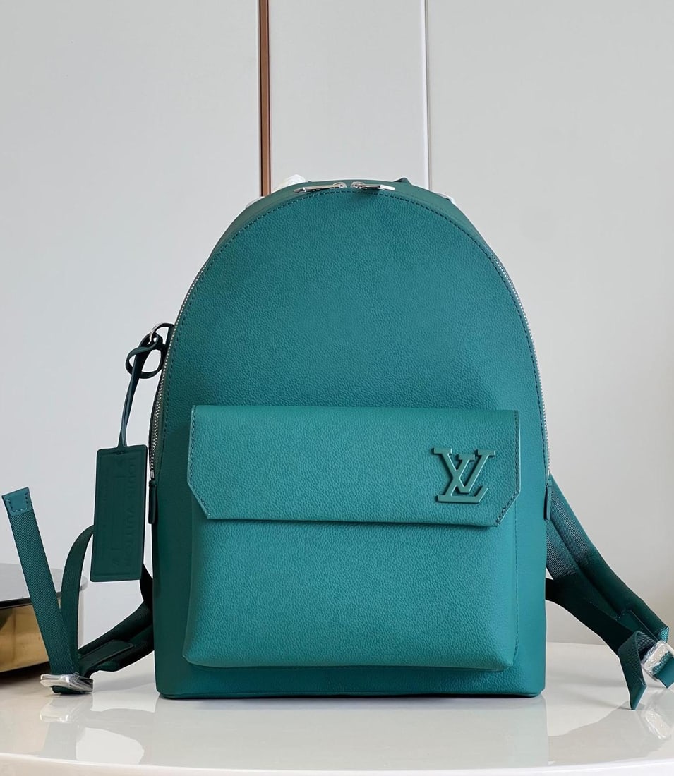 LV Aerogram: This backpack is crafted from LV Aerogram calfskin leather in a sophisticated, muted tone, exuding elegance. The tag resembles a departure stamp, while the slanted corners of the front flap evoke vint