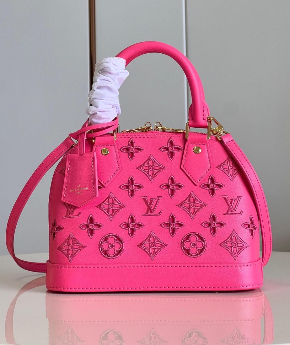 LV Alma BB: This Alma BB handbag is from this season's LV Broderie Anglaise collection. The supple calfskin is adorned with the iconic Monogram perforated pattern, creating a captivating and unique design. The op