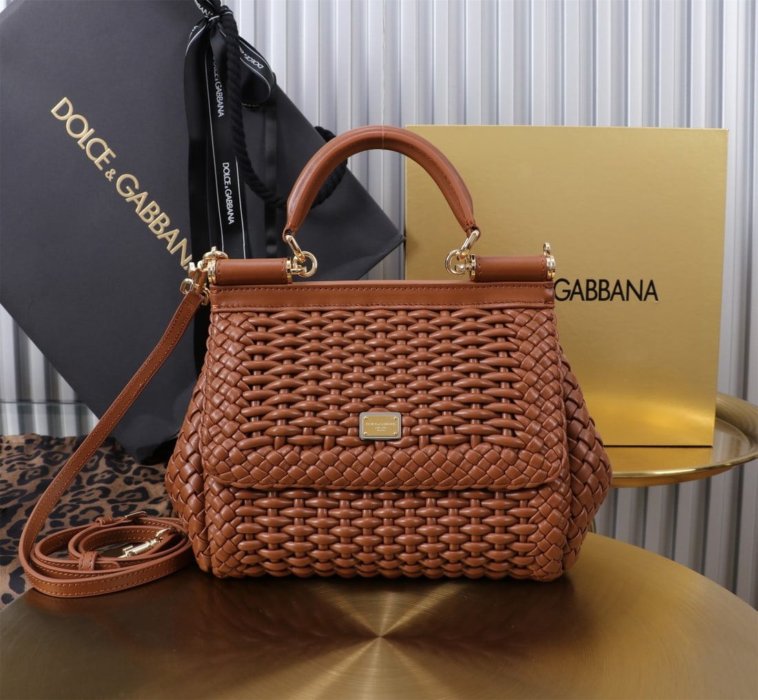 Dolce & Gabbana: Woven Size: 20x16x8cm. A signature hand-woven design from Dolce & Gabbana's Sicily brand, now presented in a compact version. Easily organizes frequently used items with a unique design. The front