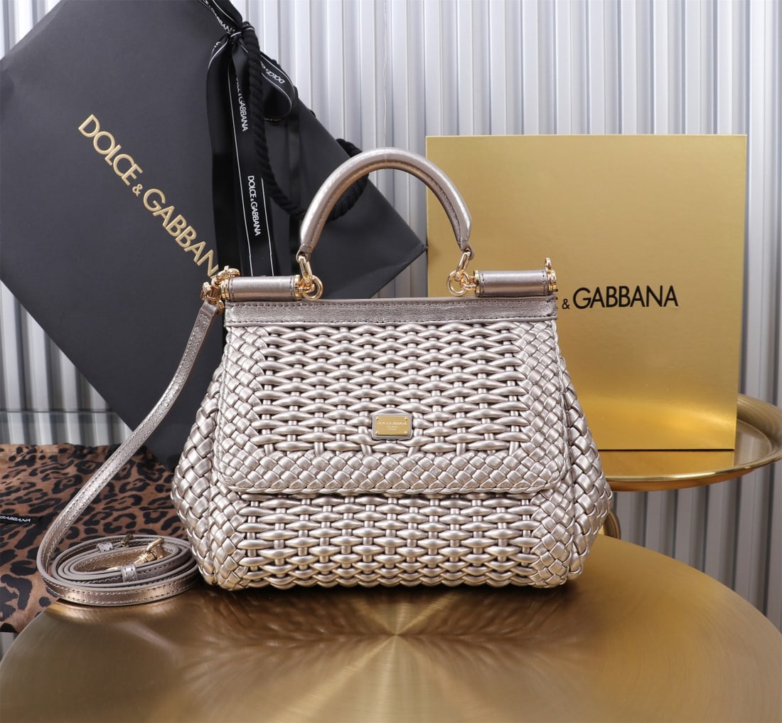 Dolce & Gabbana: Woven Size: 20x16x8cm. A signature hand-woven design from Dolce & Gabbana's Sicily brand, now presented in a compact version. Easily organizes frequently used items with a unique design. The front