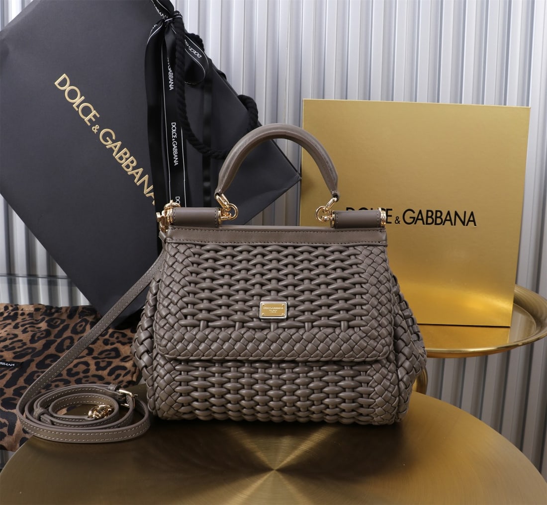 Dolce & Gabbana: Woven Size: 20x16x8cm. A signature hand-woven design from Dolce & Gabbana's Sicily brand, now presented in a compact version. Easily organizes frequently used items with a unique design. The front