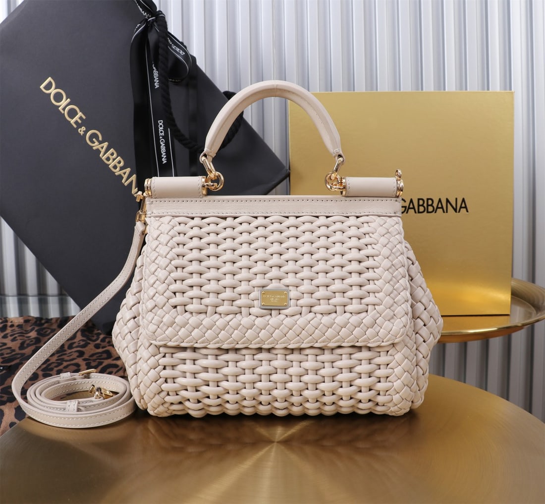 Dolce & Gabbana: Woven Size: 20x16x8cm. A signature hand-woven design from Dolce & Gabbana's Sicily brand, now presented in a compact version. Easily organizes frequently used items with a unique design. The front