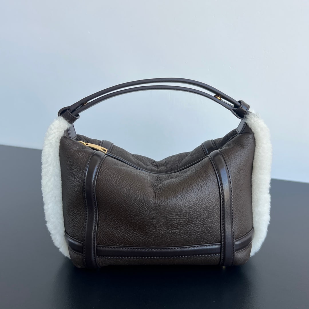 Bottega Veneta Wallace: Bottega Veneta's adorable plush Wallace bag is irresistible! It's a must-have for elevating your style. Made of brown twill quilted lambskin with white plush trim, the exposed fur edges offer a soft, 