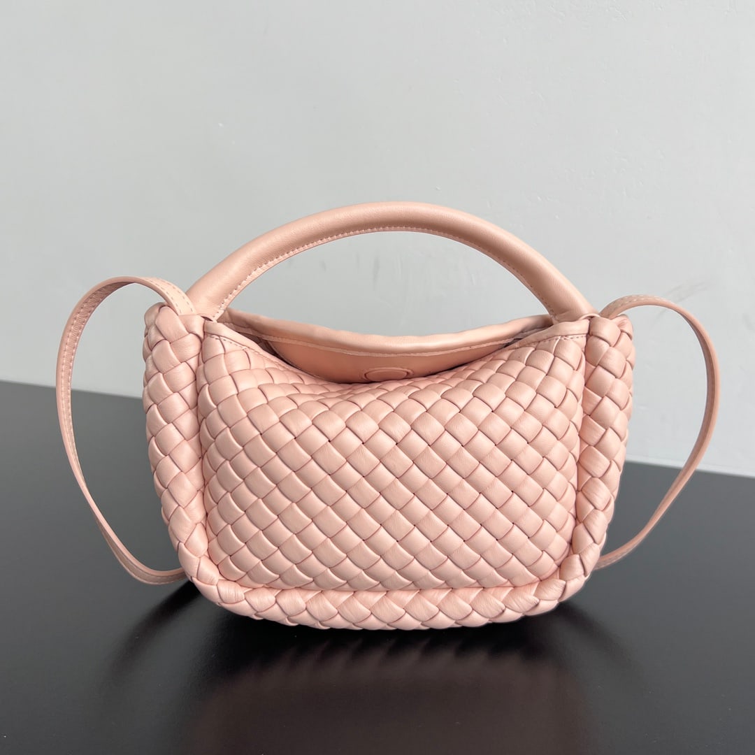 Bottega Veneta Cobble: The Bottega Veneta Mini Cobble handbag is an adorable ingot-shaped design. Made of woven lambskin with cotton lining, it boasts a delicate and silky feel. Its rounded and cute shape exudes the brand's
