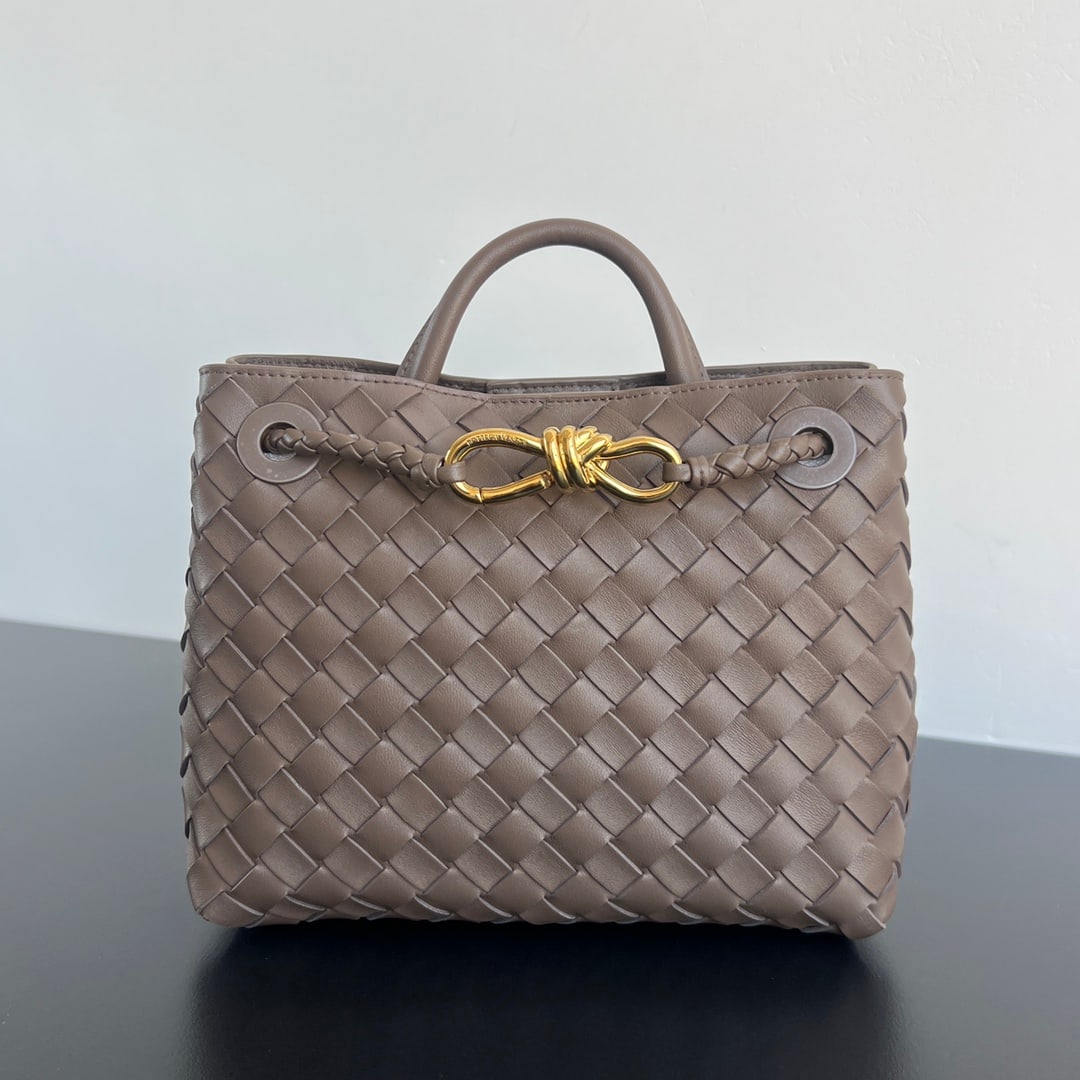 Bottega Veneta Andiamo: The Bottega Veneta 2023 Andiamo handbag, a favorite among many celebrities, features a classic all-over leather woven design with a gold rope knot clasp, exuding both sophistication and elegance. Made