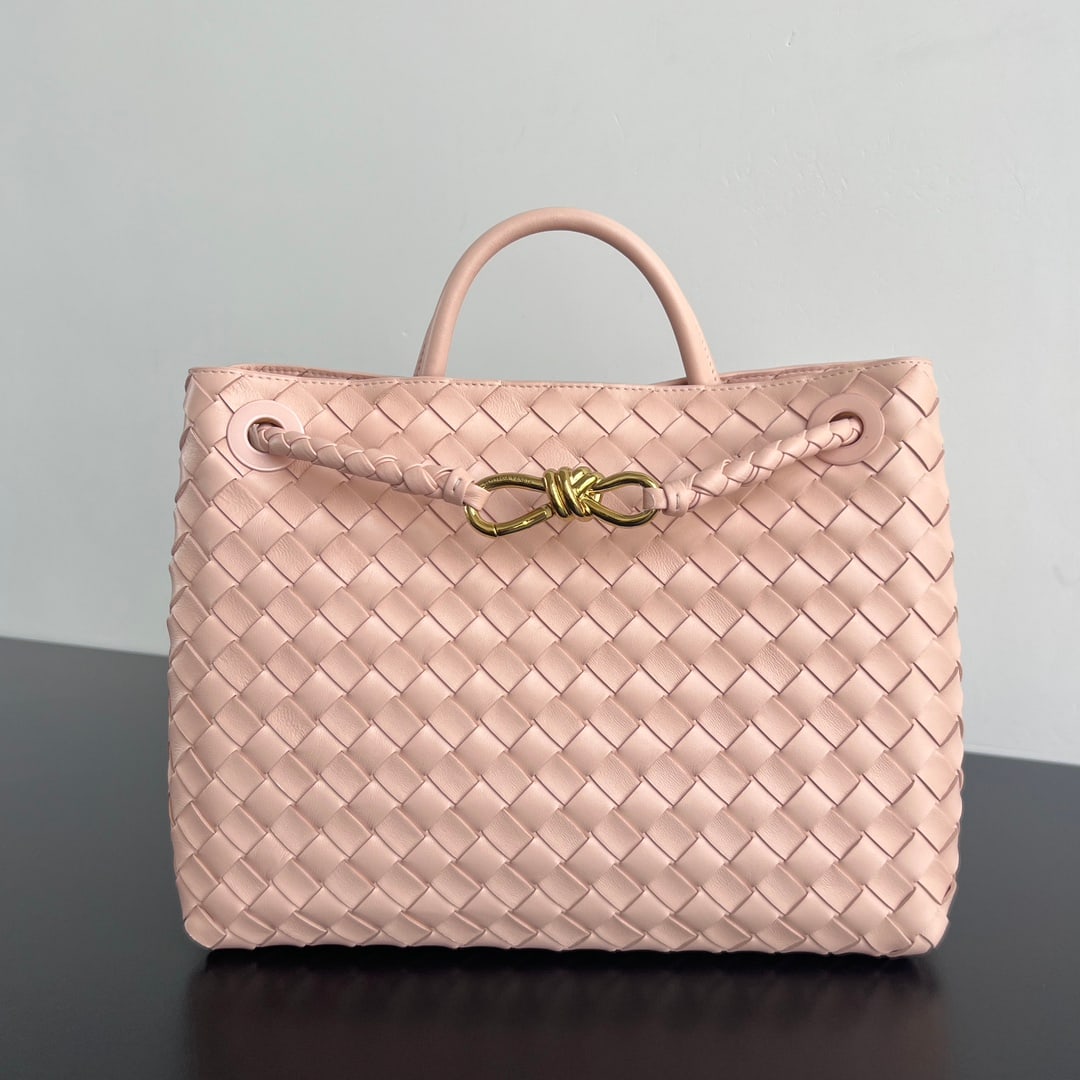 Bottega Veneta Andiamo: The Bottega Veneta 2023 Andiamo handbag, a favorite among many celebrities, features a classic all-over leather woven design with a gold rope knot clasp, exuding both sophistication and elegance.