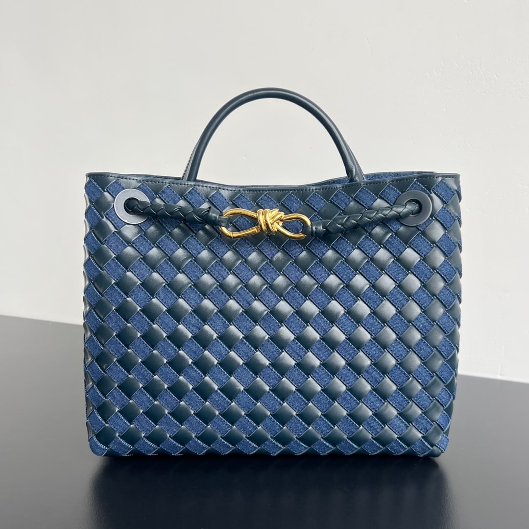 Bottega Veneta Andiamo: Bottega Veneta Andiamo Denim and Leather Patchwork: The contrast between the stiffness of denim and the softness of leather creates a stylish and sophisticated look. The denim is meticulously