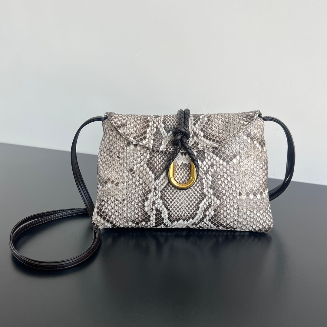 Bottega Veneta Liberta: The Bottega Veneta Liberta snakeskin crossbody bag is crafted from Vietnamese python skin. The raised, intricate scales and vibrant colors give the bag an unparalleled texture and feel. The metal