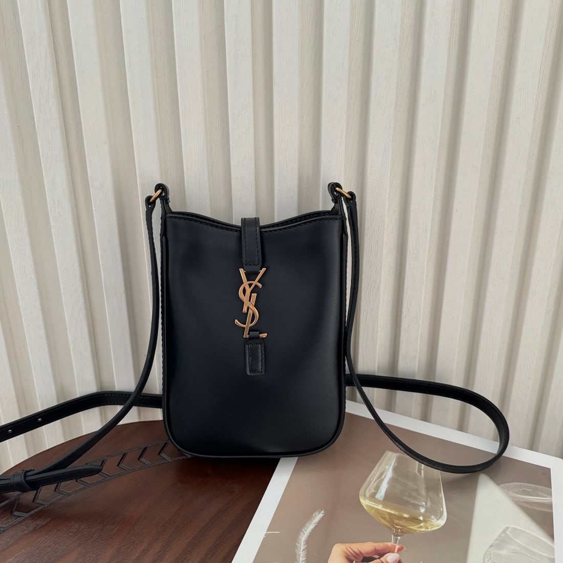Yves Saint Laurent LE: LE HOBO Mini Vertical Phone Bag: Compact, exquisite, and stylish, this crossbody bag design is easy to match with various outfits. It easily holds your phone, lipstick, and other essentials. If you're