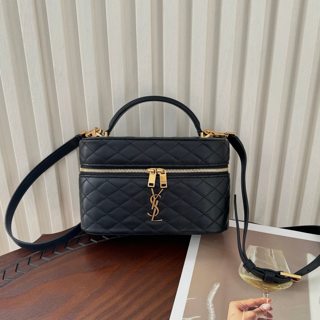 Yves Saint laurent GABY VANITY BAG: The GABY VANITY BAG is made of fine lambskin, featuring a delicate box-shaped design and continuing the retro-elegant diamond quilting element. A two-way zipper makes it easy to access your belongings