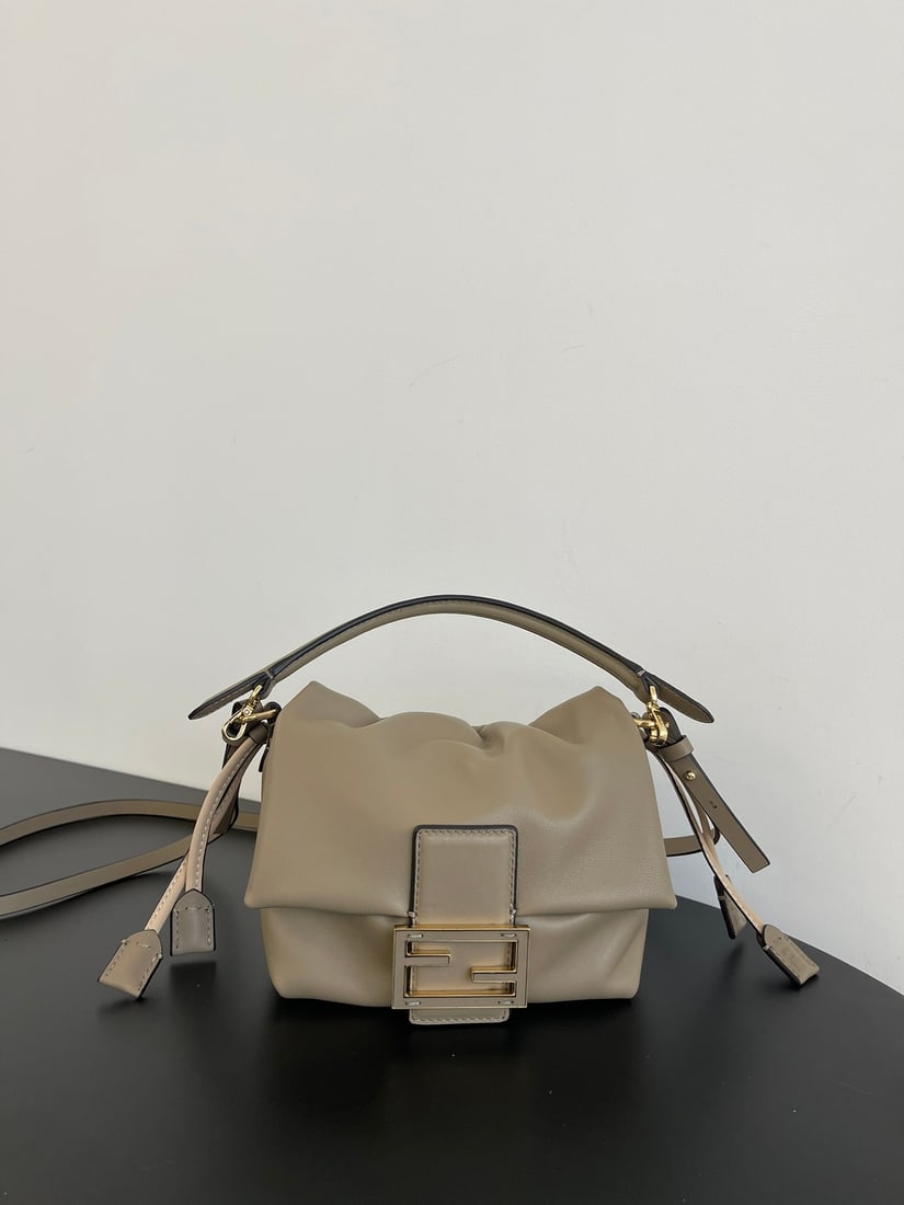 Fendi Mamma Baguette: The small Mamma Baguette in pigeon grey is a combination of a baguette and a lucky bag, arguably the most gentle bag online. The soft, supple lambskin is incredibly delicate, exuding both a relaxed an