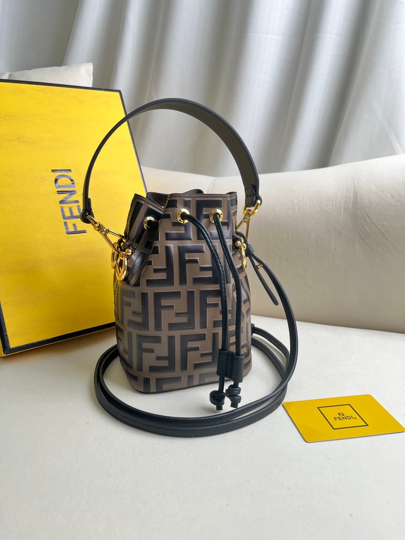 Fendi Mon Tresor: Khaki Mon Tresor Light Blue Leather Mini Handbag. This Mon Tresor small bucket bag features a drawstring closure and Fendi metal logo trim. It comes with two detachable shoulder straps (one long, one
