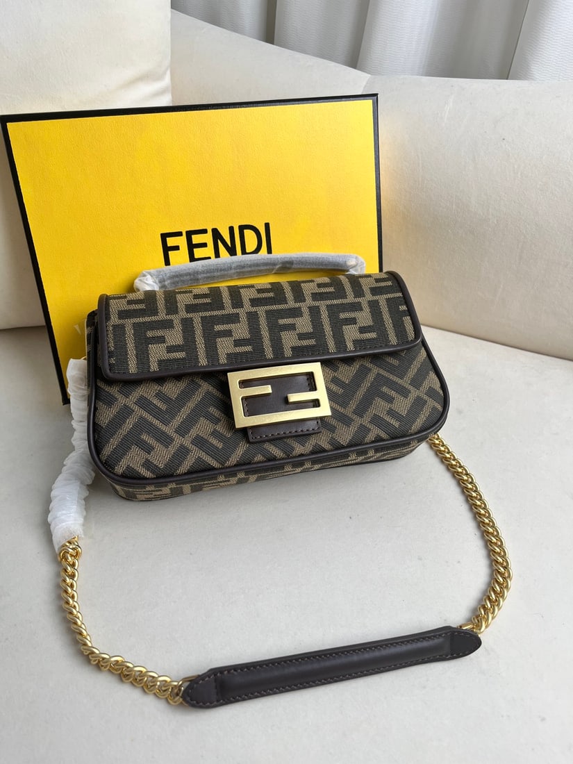 Fendi Iconic Baguette: Iconic Baguette medium chain handbag, made of jacquard fabric with an FF pattern. Features an FF clasp, a front flap, magnetic closure, lined interior compartment, zip pocket, and vintage gold-tone ha
