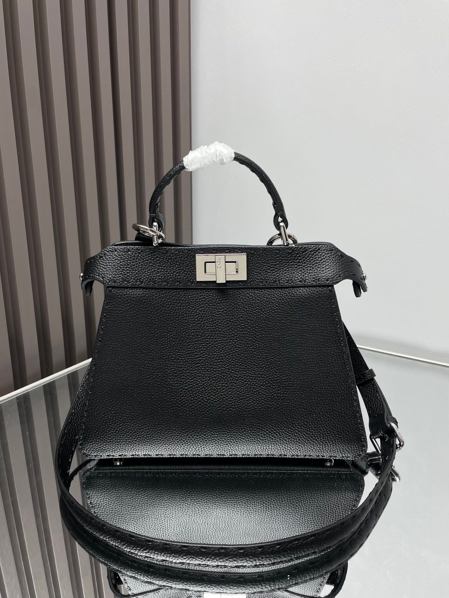 Fendi Iconic Peekaboo ISeeU: Iconic Peekaboo ISeeU Small Handbag, crafted from brown Cuoio Romano leather with hand-stitched color-matching details and classic twist locks on both sides. Lined with a leather Selleria stamp, the