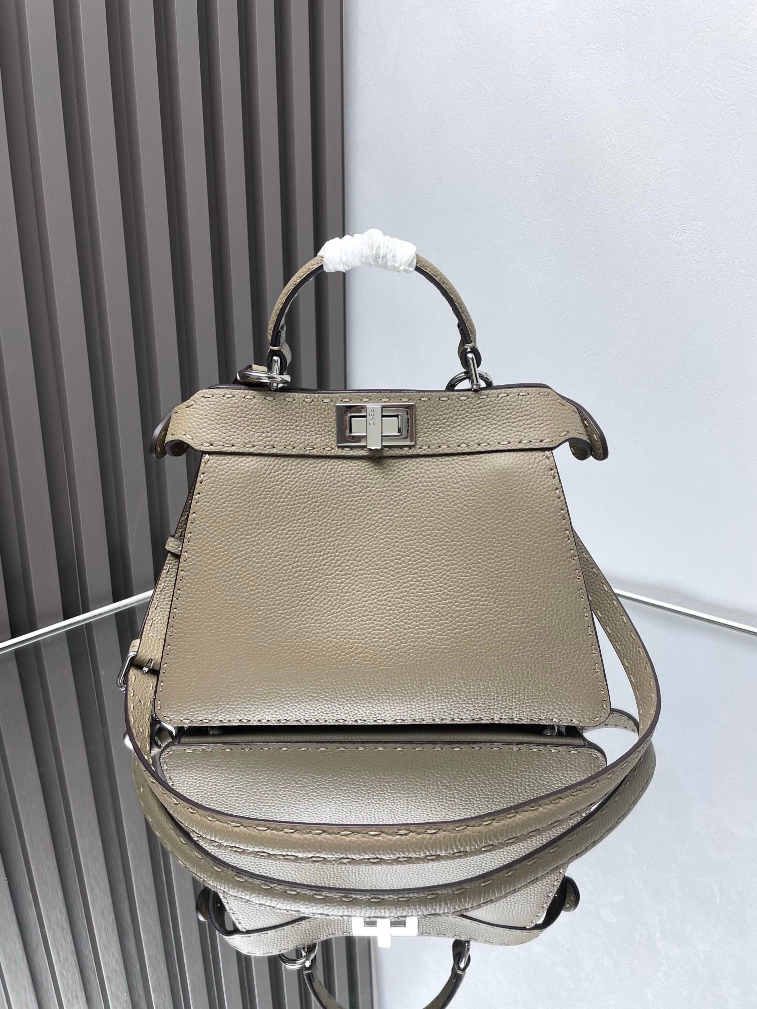 Fendi Iconic Peekaboo ISeeU: Iconic Peekaboo ISeeU Small Handbag, crafted from brown Cuoio Romano pebbled calfskin leather with hand-stitched detailing and contrasting color stitching. Features classic twist locks on both sides.