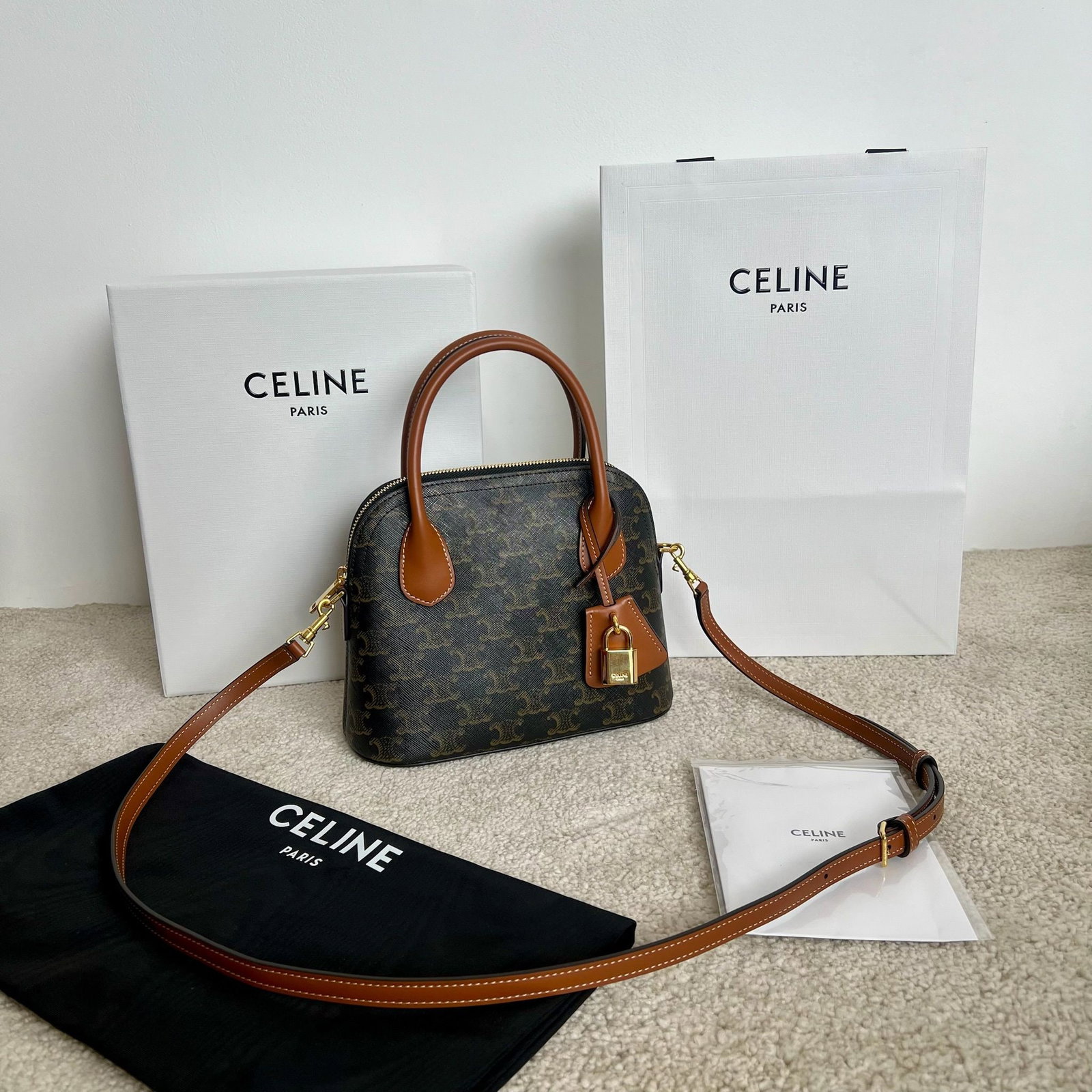 Celine: TEEN HONORINE logo print handbag (22 x 17.5 x 9.5 cm) can be carried by hand, over the shoulder, or crossbody. Features a logo print, gold-finish zip closure, one main compartment, one flat pocket,