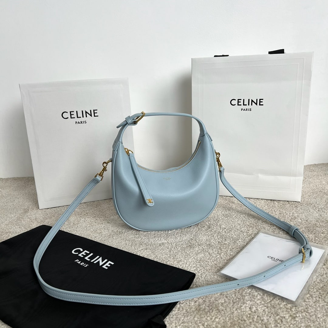 Celine TEEN LULU: This TEEN LULU soft grained cowhide leather handbag can be carried by hand, over the shoulder, or crossbody. It can fit a large smartphone (21 x 24 x 5 cm). Features include cowhide leather, suede lin