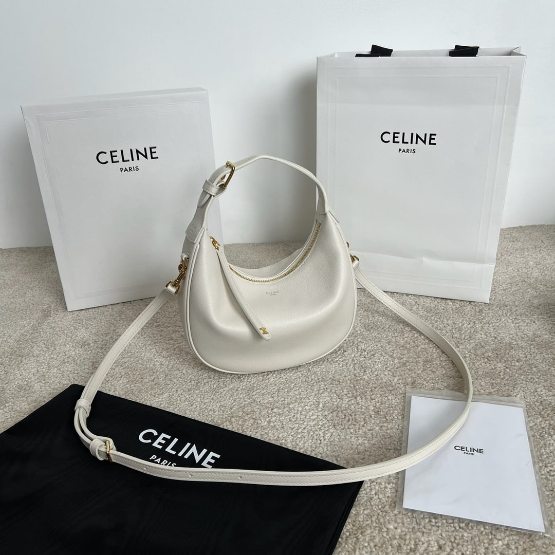 Celine TEEN LULU: This TEEN LULU soft grained cowhide leather handbag can be carried by hand, over the shoulder, or crossbody. It can fit a large smartphone (21 x 24 x 5 cm). Features include cowhide leather, suede