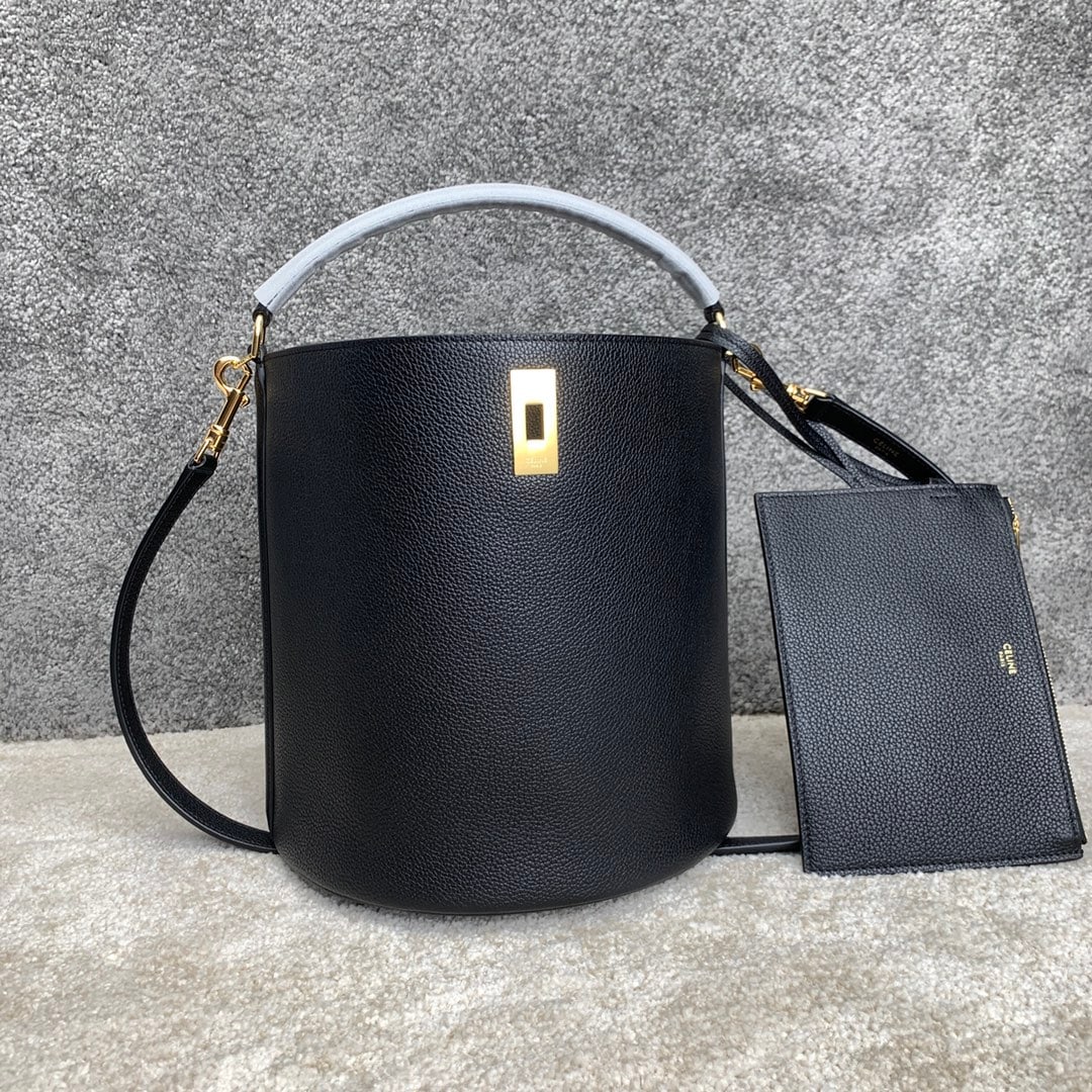 Celine Bucket: BUCKET 16 Calfskin Leather Handbag 9 x 10 x 9 inches (23 x 25 x 23 cm) Calfskin leather lining; fabric turn-lock closure; removable zip pocket; removable leather shoulder strap 20 inches (52 cm)