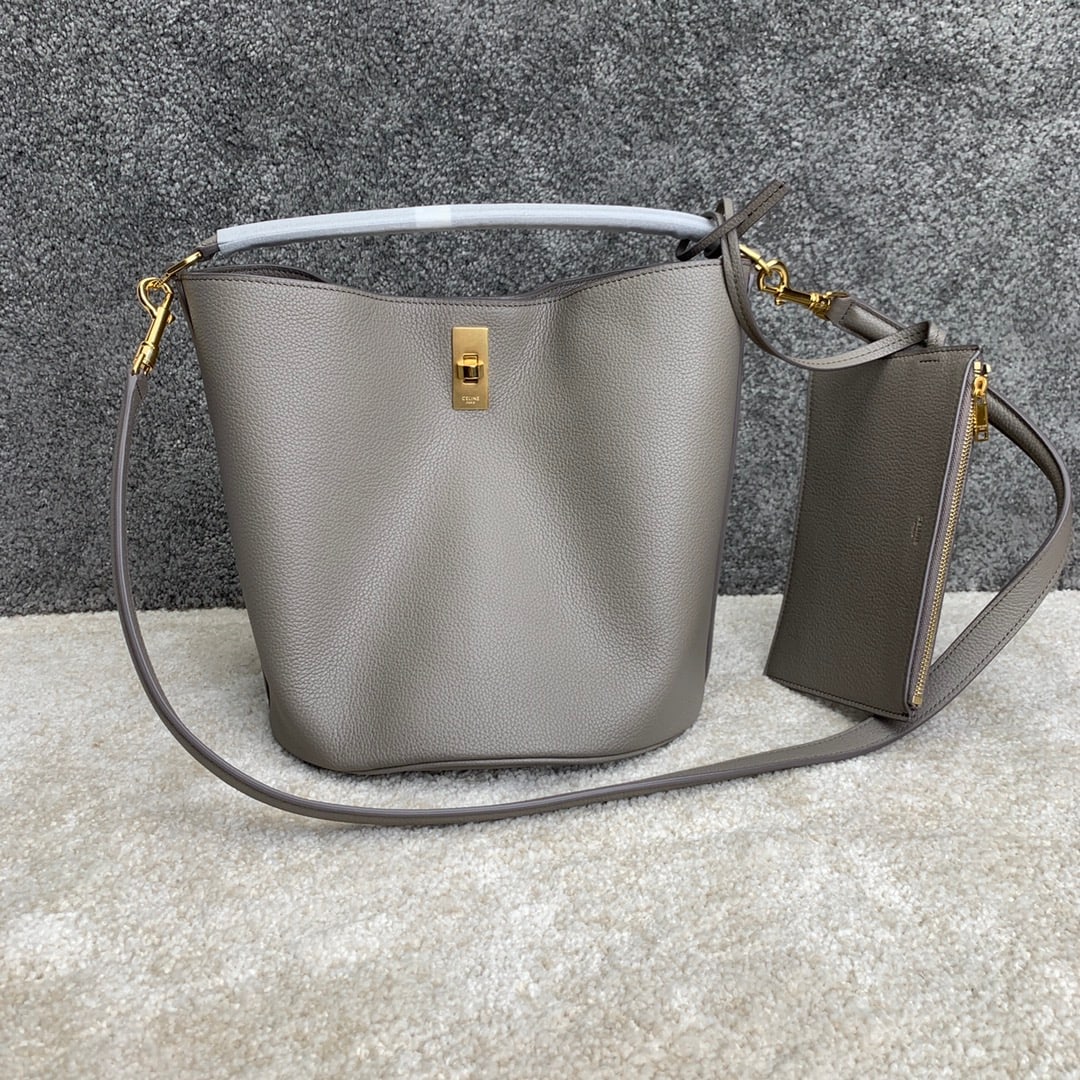Celine Bucket: BUCKET 16 Calfskin Leather Handbag 9 x 10 x 9 inches (23 x 25 x 23 cm) Calfskin leather lining; fabric turn-lock closure; removable zip pocket; removable leather shoulder strap 20 inches (52 cm) long;