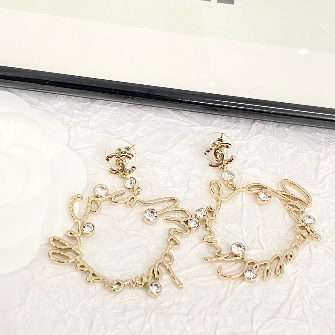 Chanel crystal lettering openwork irregular-shaped earrings: Chanel stud earrings feature crystal-encrusted lettering and an asymmetrical, dynamic design. The raised, textured double-C design adds a touch of sophistication and quality. The unique,