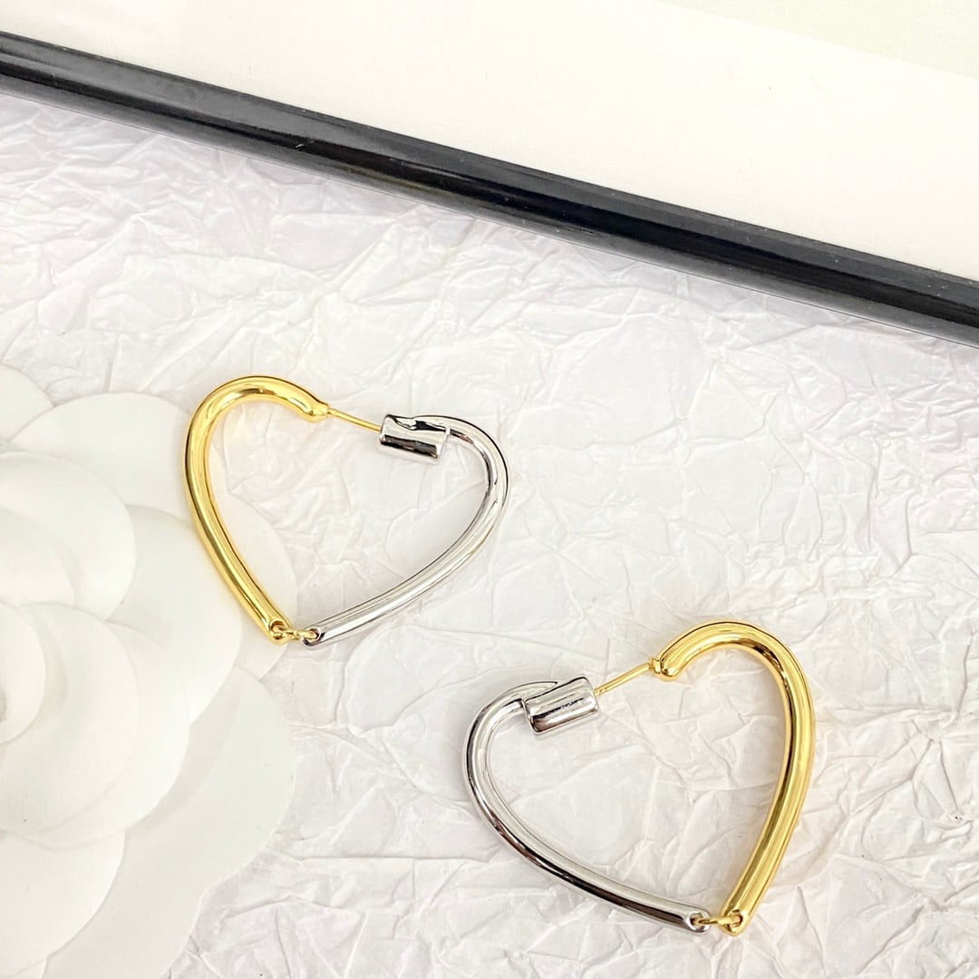 Celine gold and silver two-tone heart earrings: Celine gold and silver two-tone heart earrings: These stunning heart-shaped earrings feature a striking gold and silver contrast, creating a fashionable, simple yet creative design that blends