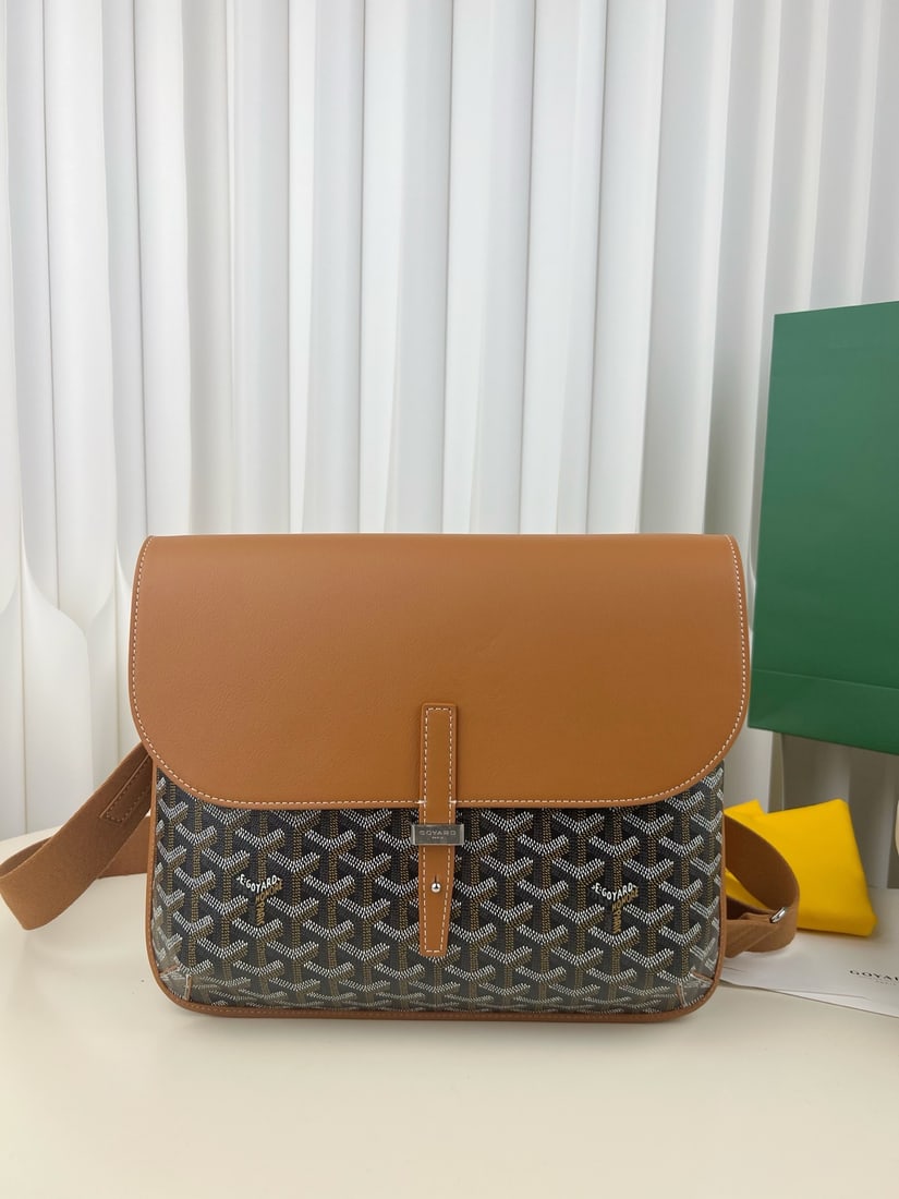 Goyard coursier: The Goyard coursier crossbody messenger bag features a top-grain calfskin flap that is suede underneath, giving it a premium feel. The body is made of Goyardine canvas, with hard-pack-style binding at